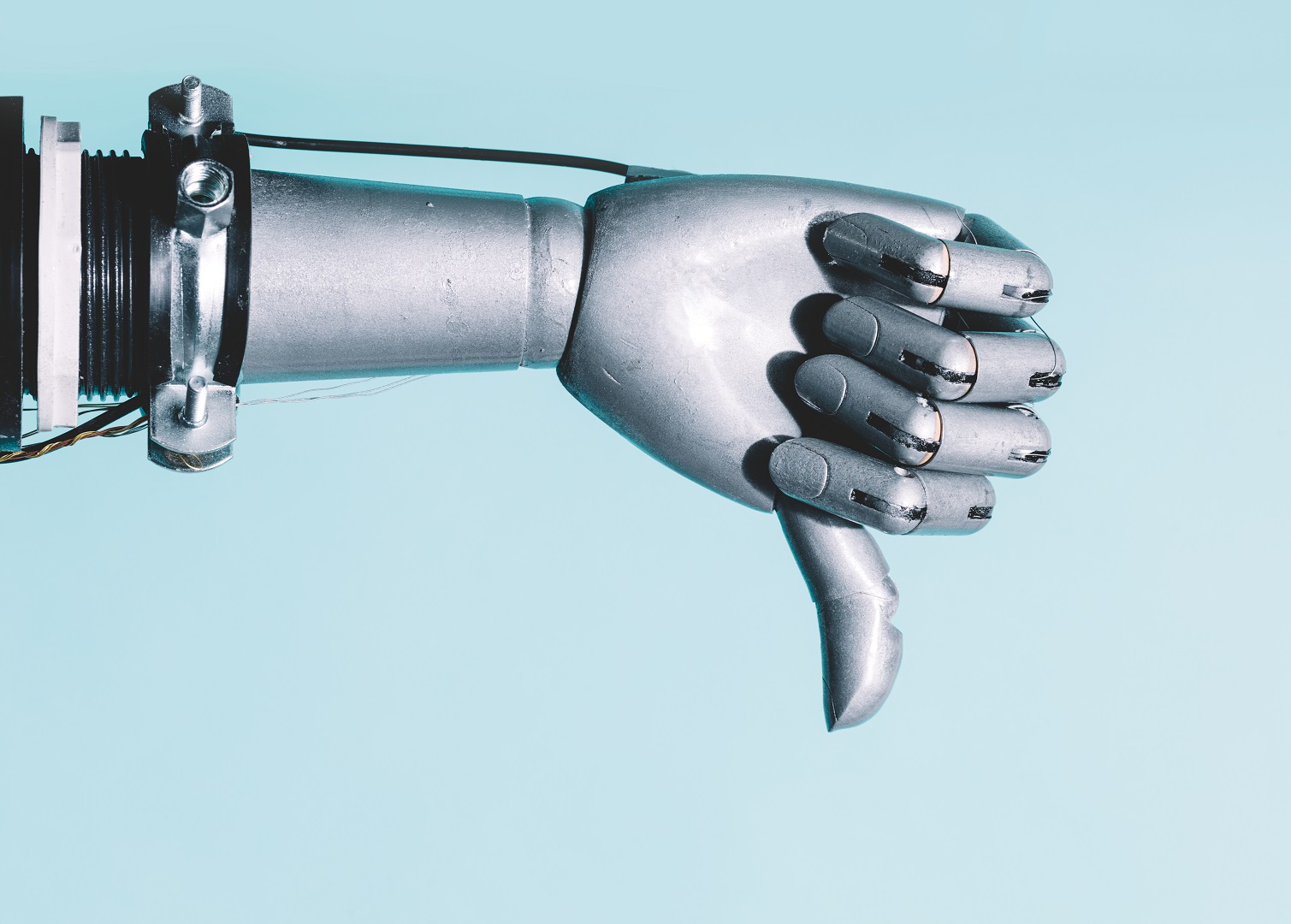 Arm of robot giving a thumbs down to AI transcriptions